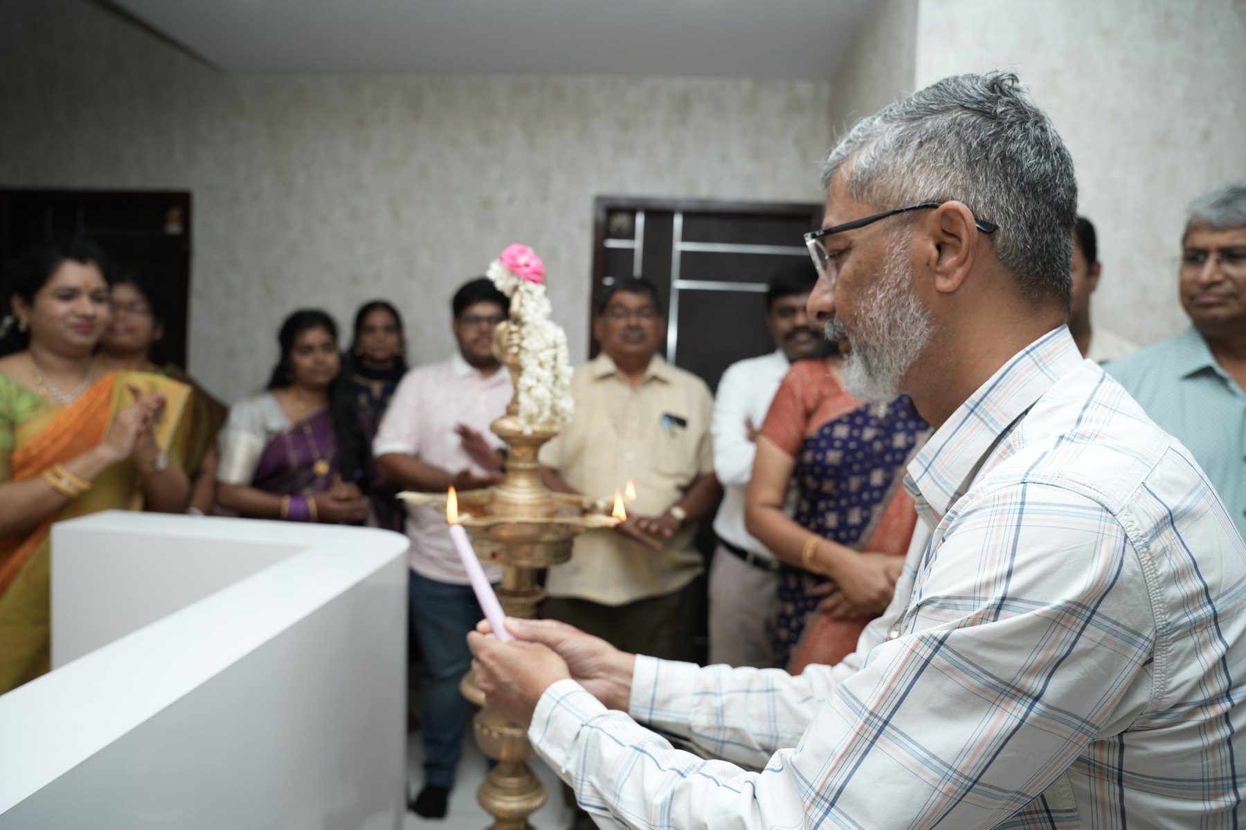 Dr. S. Thirunavukkarasu during the traditional lamp lighting at Samara Assisted Living