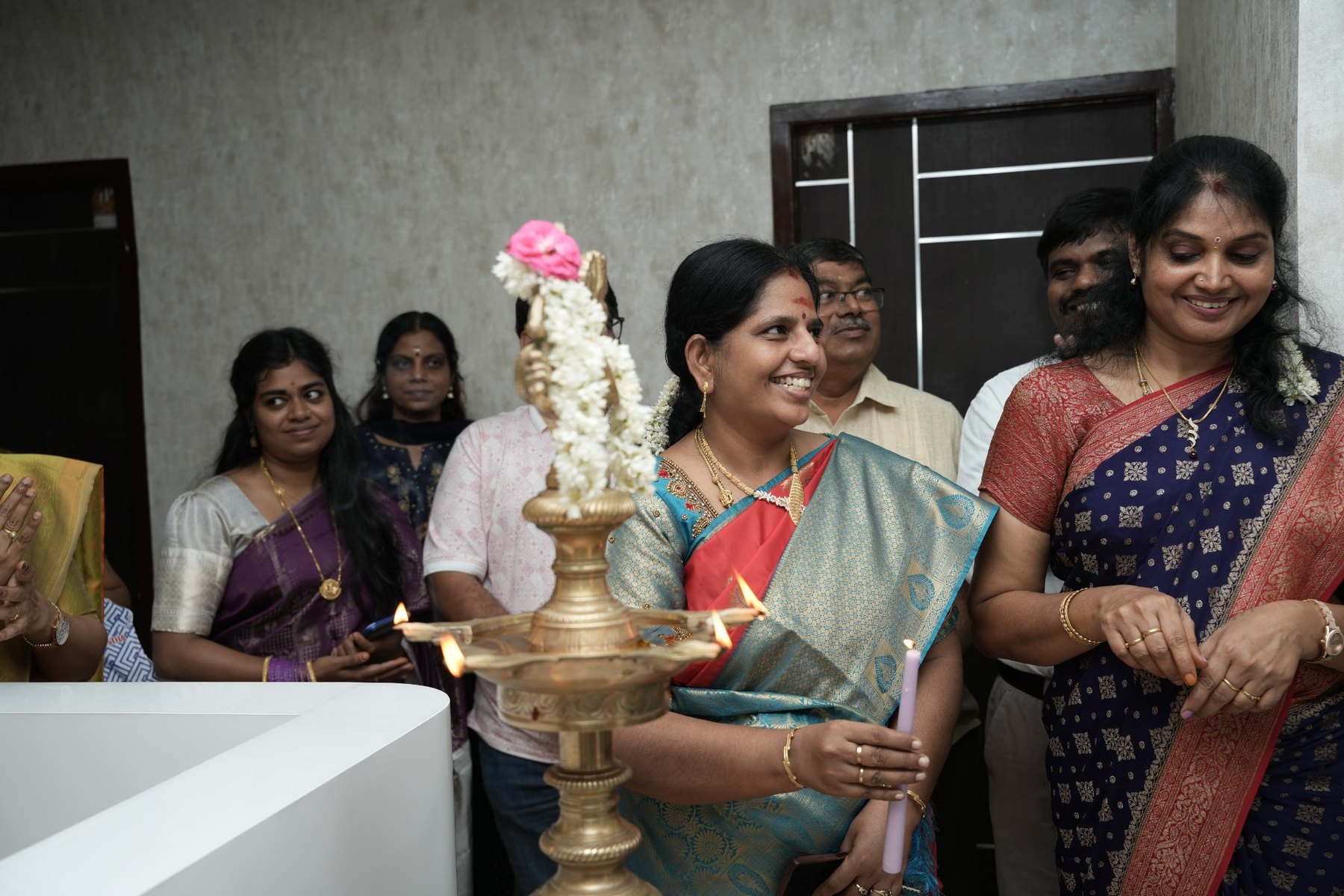 Dr. Uma Balamuruga during the traditional lamp lighting at Samara Assisted Living